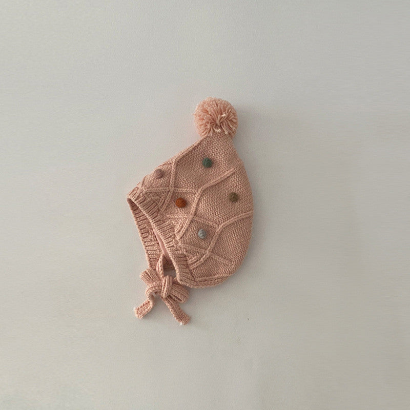 Pink cable-knit earflap hat with chin ties