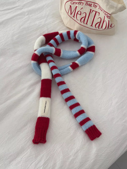 Unisex Red Stripe Skinny Scarf — slim striped scarf tied in a loose front knot