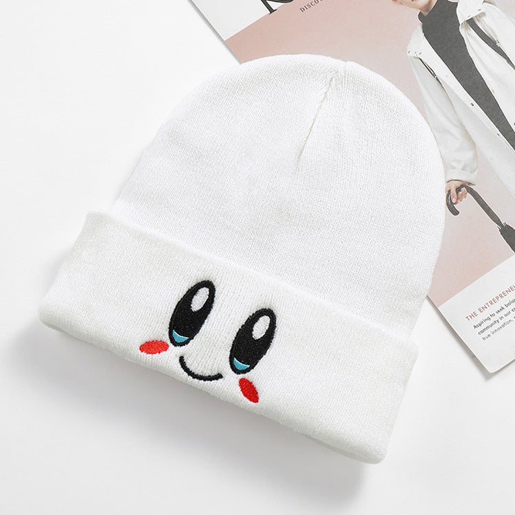 White embroidered smile beanie displayed from the front