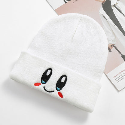 White embroidered smile beanie displayed from the front