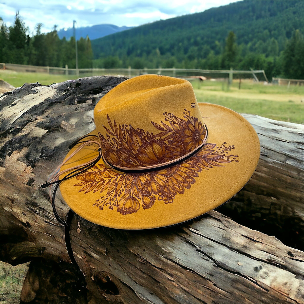 Rear angled view of the Aurelia hat showing its crown artwork