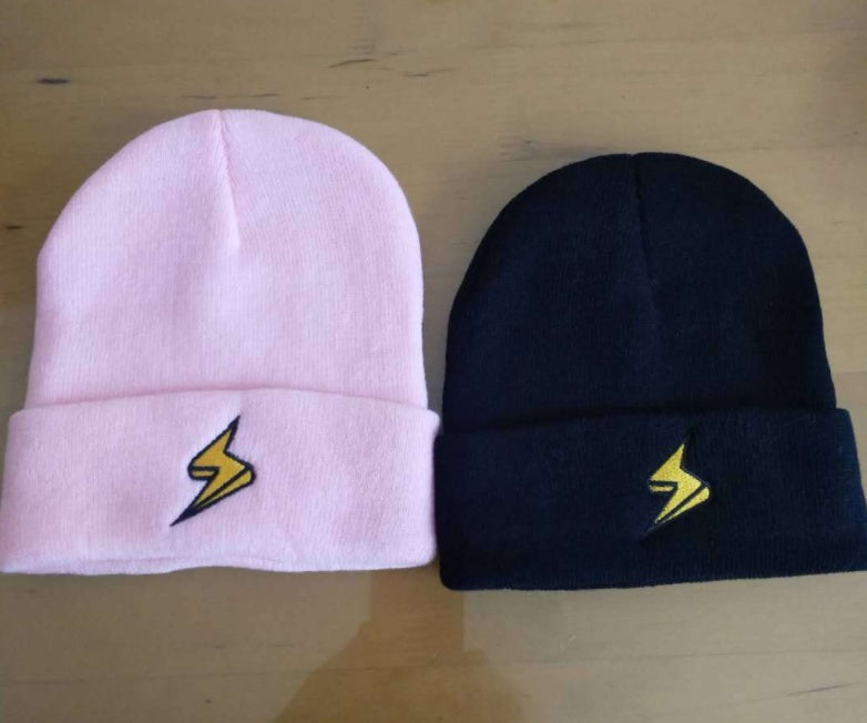 Pink and dark beanies with contrasting yellow lightning embroidery