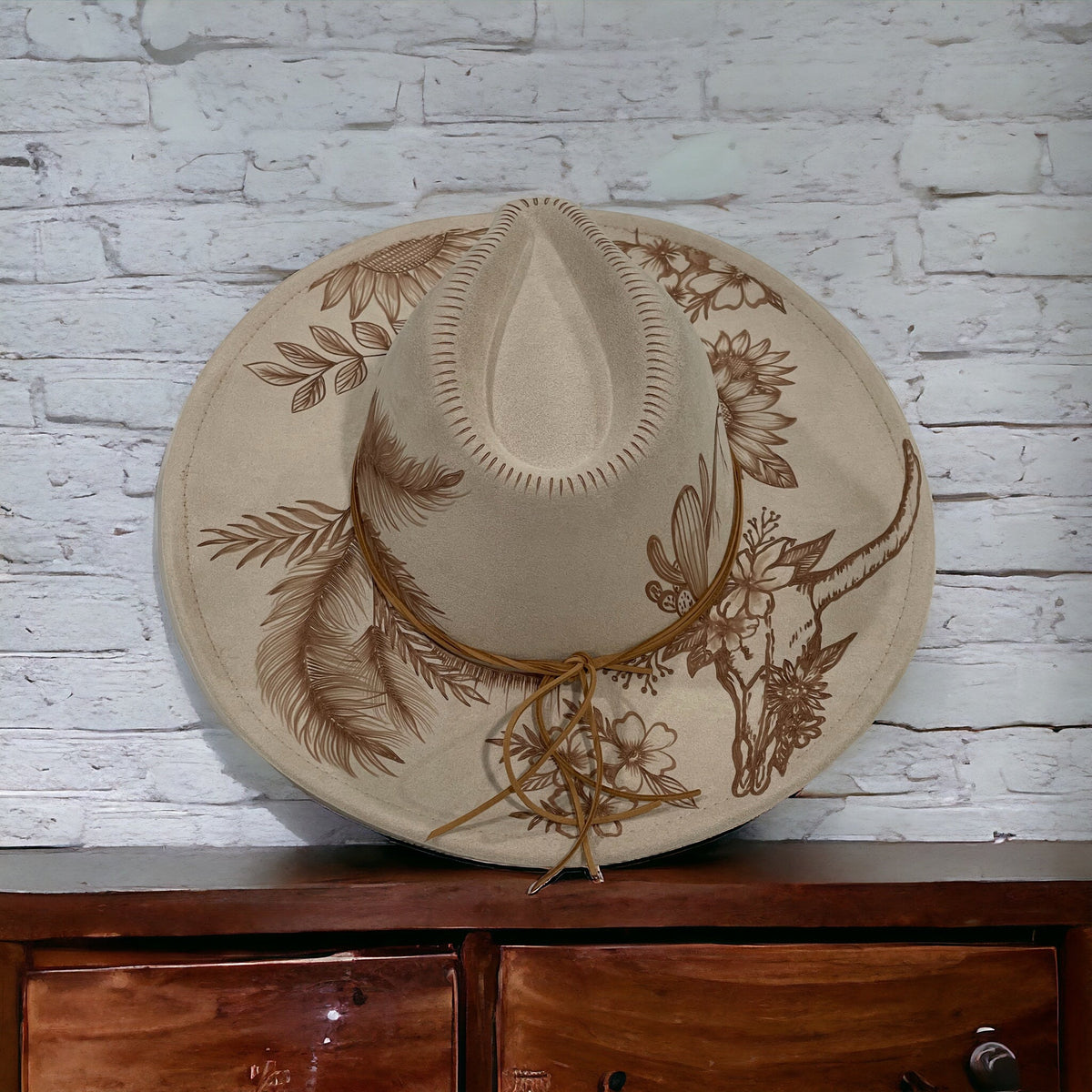 Beige Piper Boho Luxe hat with lotus-inspired flowers and leafy burned artwork