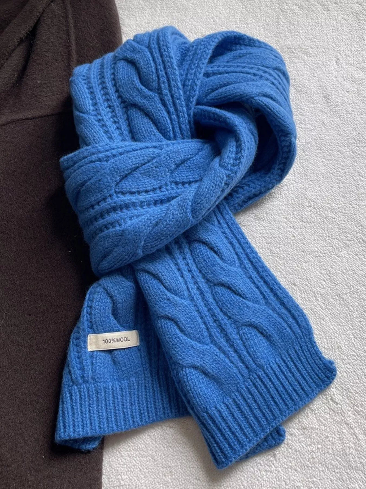 Unisex Wool Cable Knit Winter Scarf — blue wool cable scarf tied with ribbed ends visible