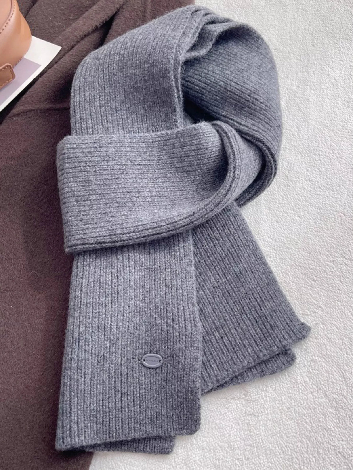 Unisex Pure Wool Soft Knit Scarf — gray pure wool scarf tied on a light surface