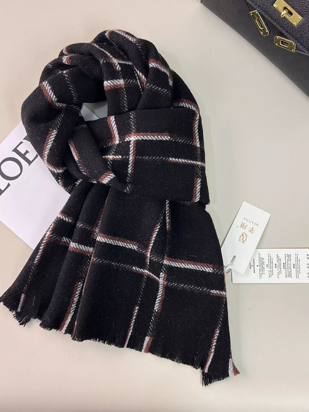 Unisex 100% Wool Raw Hem Plaid Scarf — black scarf with pale windowpane lines in a loose knot