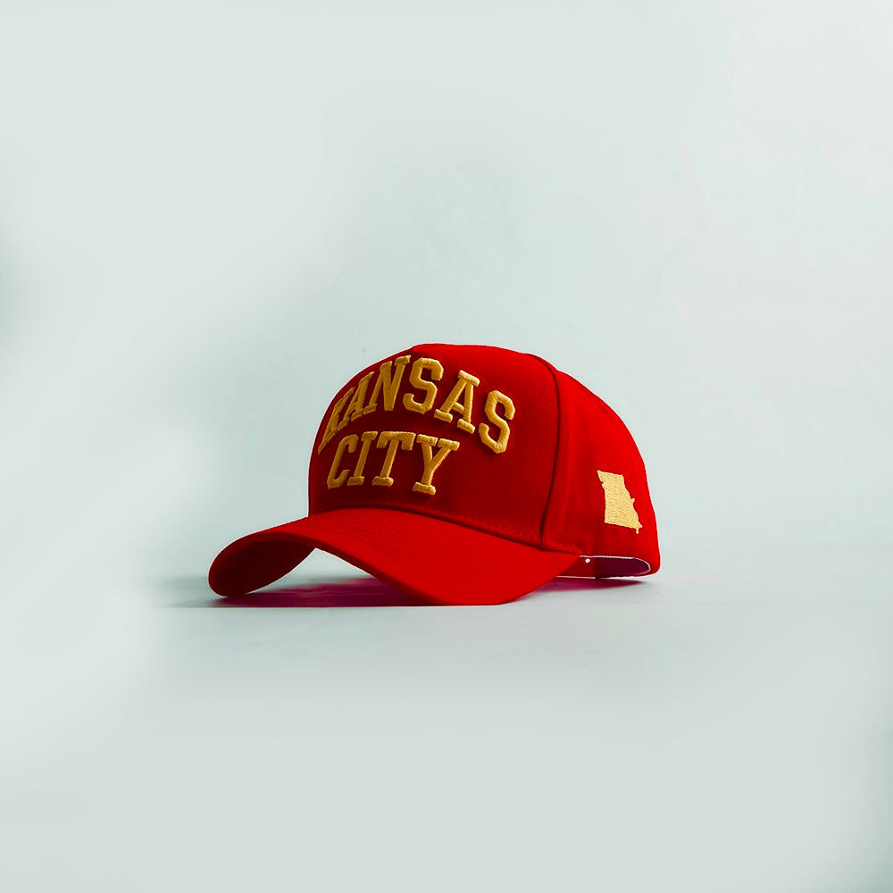 Destination Hat Co. Kansas City Legacy snapback with red crown and red bill, angled view