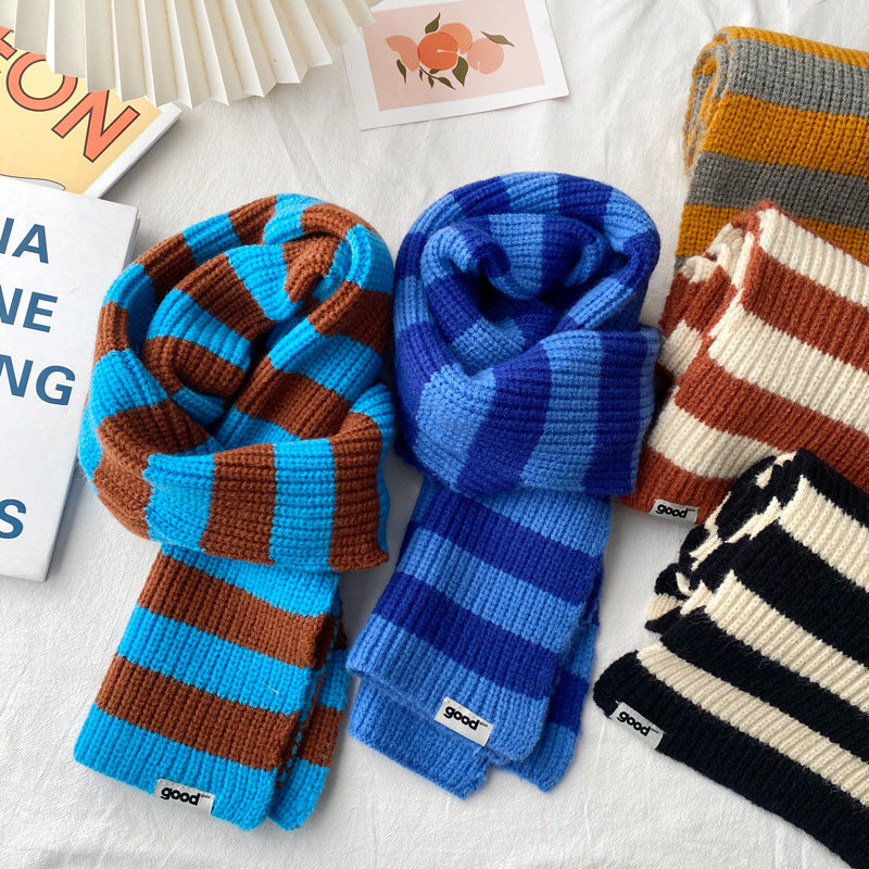 Blue brown and rust cream striped scarves displayed together