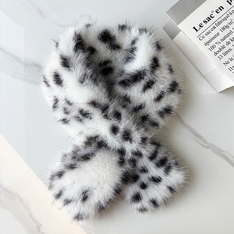 Black and white leopard faux fur scarf in a crisscross shape