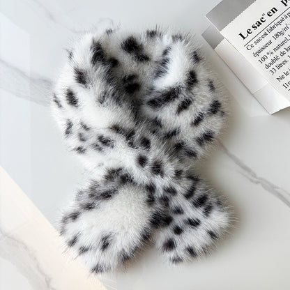 Black and white leopard faux fur scarf in a crisscross shape