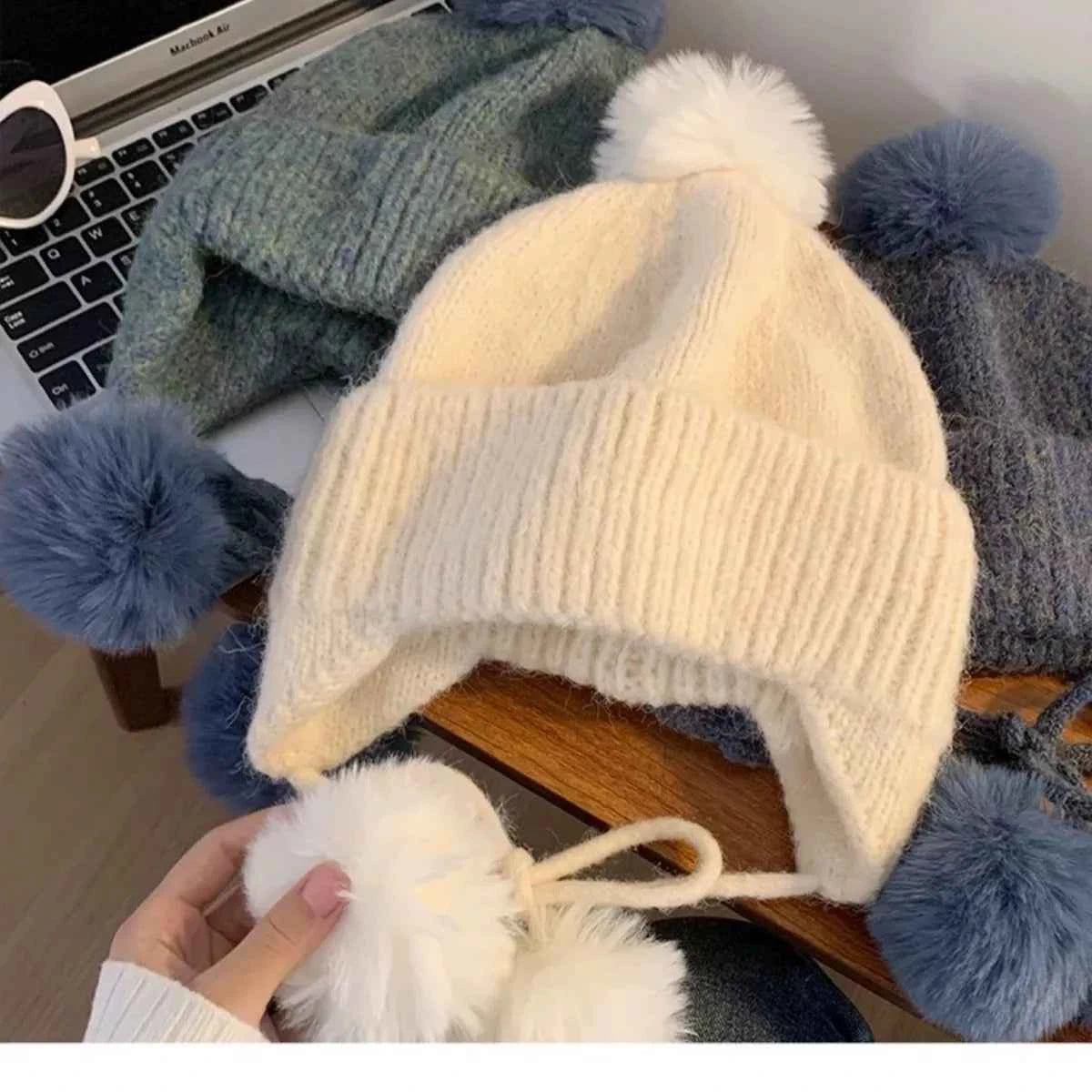 Warm knitted beanie ear flap texture close-up