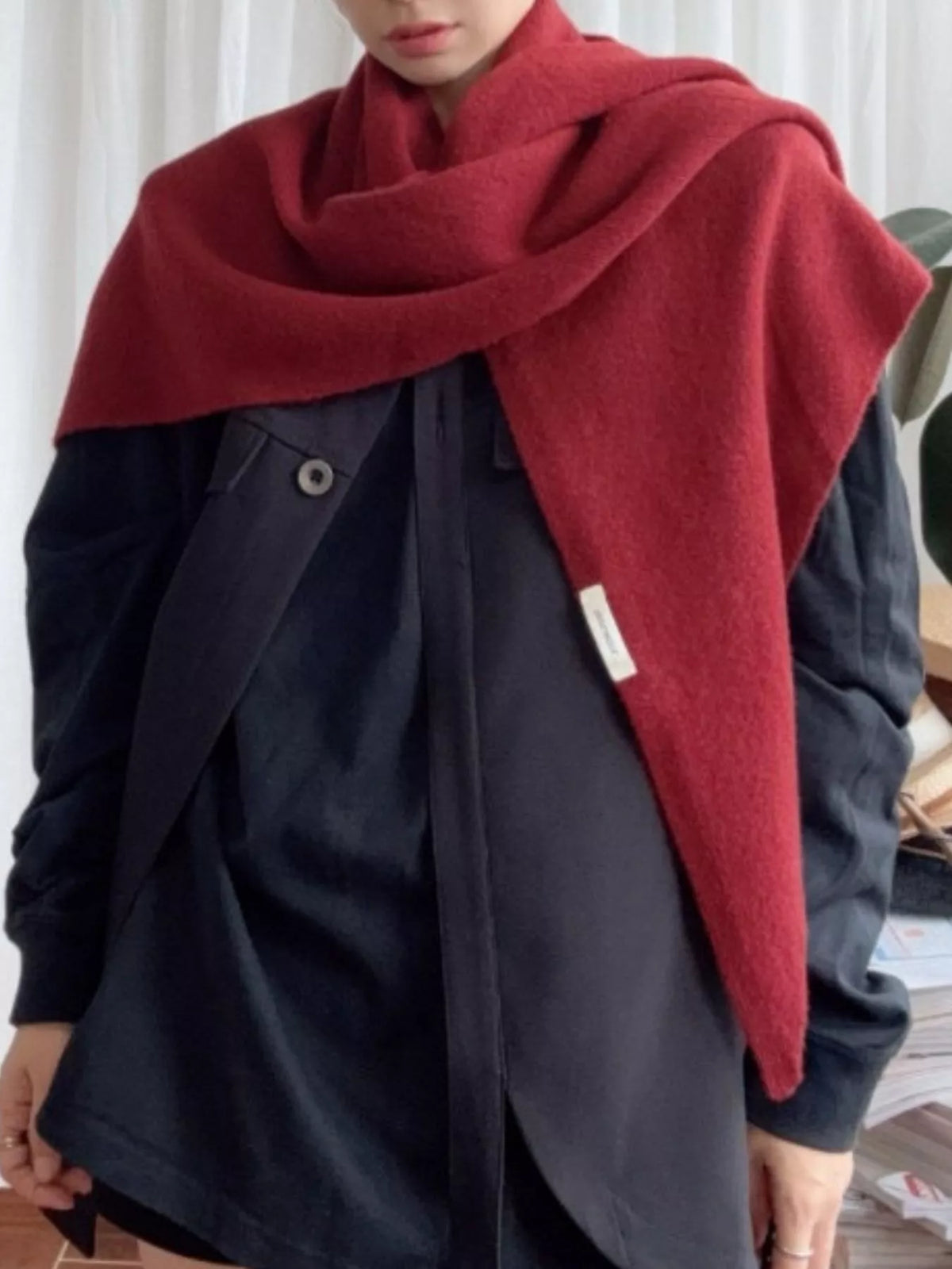 Women's Red Wool Triangle Shawl — red wool shawl worn over a dark coat