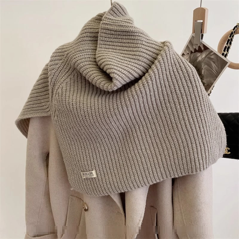 Women's Ribbed Knit Turtleneck Shoulder Wrap — rear angled view of a taupe ribbed wrap