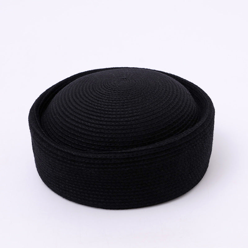 Minimalist wool pillbox hat crown and texture detail