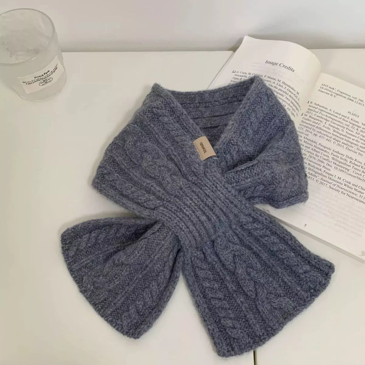 Unisex Cozy Cable Knit Scarf — gray cable knit scarf laid in a crossed shape