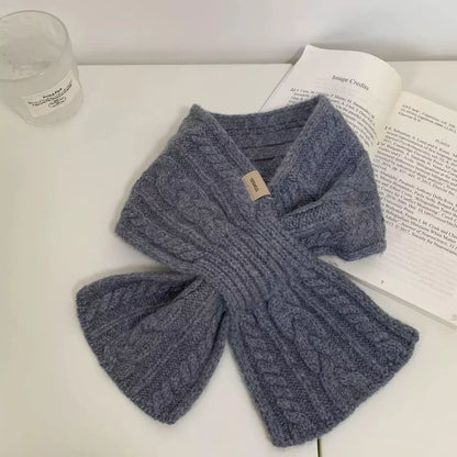 Unisex Cozy Cable Knit Scarf — gray cable knit scarf laid in a crossed shape