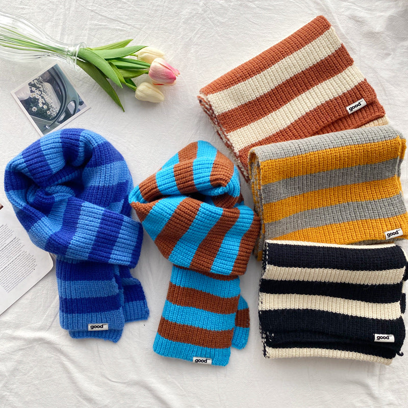 Selection of contrast striped acrylic scarves in blue rust yellow and black combinations