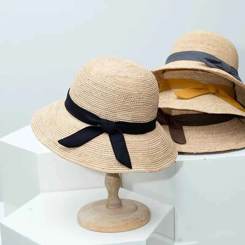 Black straw sun hat with ribbon front view