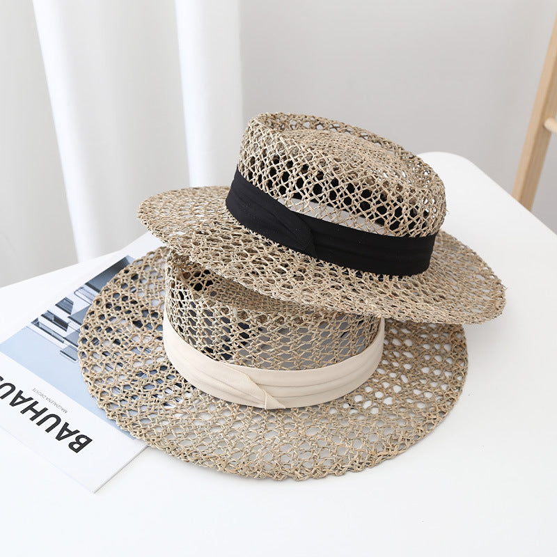 Black straw-style sun hat with satin band