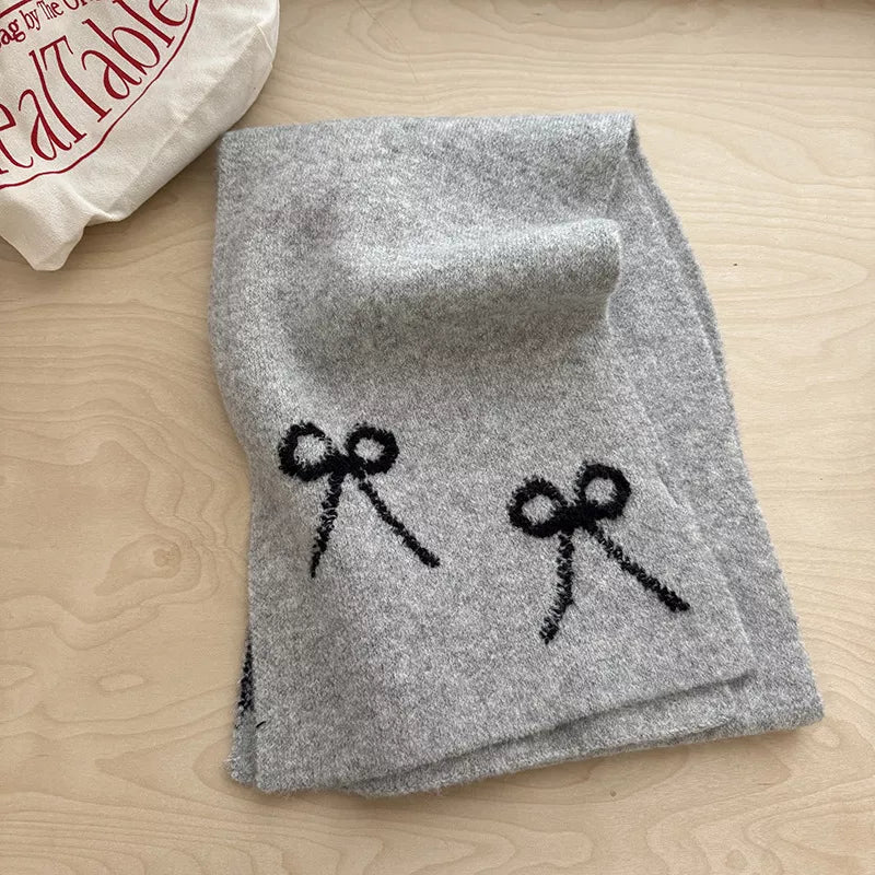 Unisex Bow Detail Knit Scarf — gray knitted scarf showing dark decorative bows