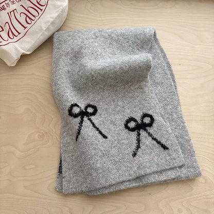 Unisex Bow Detail Knit Scarf — gray knitted scarf showing dark decorative bows