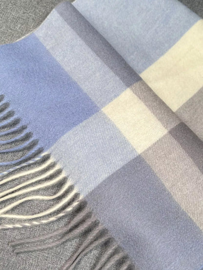 Unisex Plaid Scarf with Fringe — close view of blue plaid fabric and pale fringe
