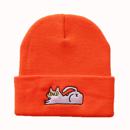Orange beanie with white reclining cat embroidery