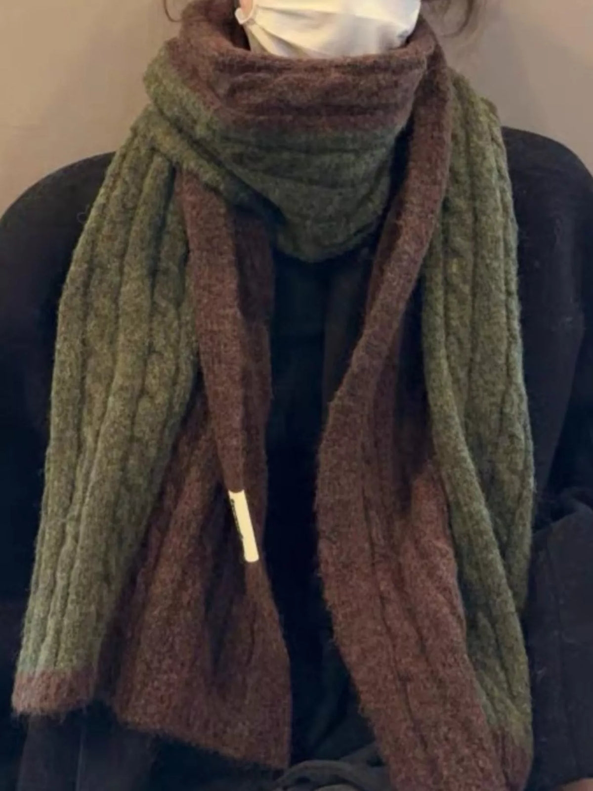 Unisex Two Tone Cable Knit Warm Scarf — close view of two-tone cable scarf styled over black outerwear