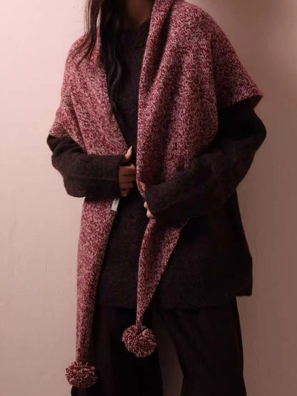 Women's Wool Pom-Pom Shawl — coral shawl worn across a dark sweater