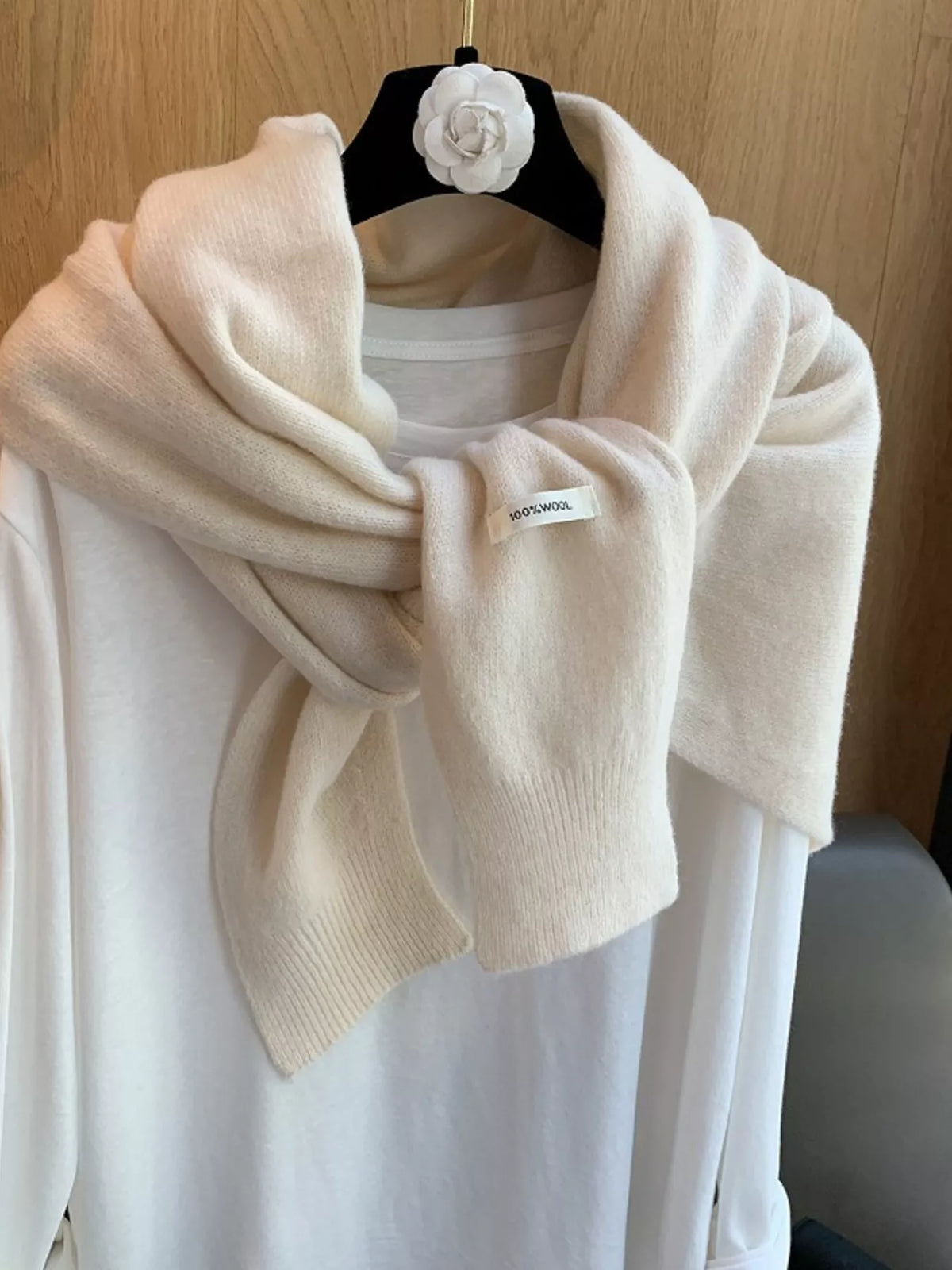 Women's Wool Knitted Asymmetrical Shawl — off-white shawl tied across a white top