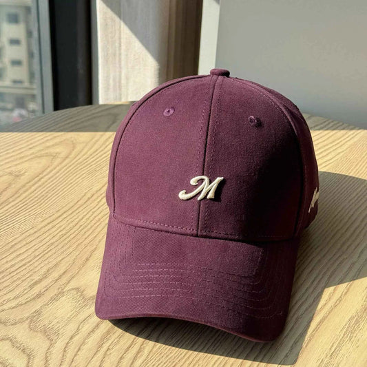 Black embroidered letter baseball cap front view
