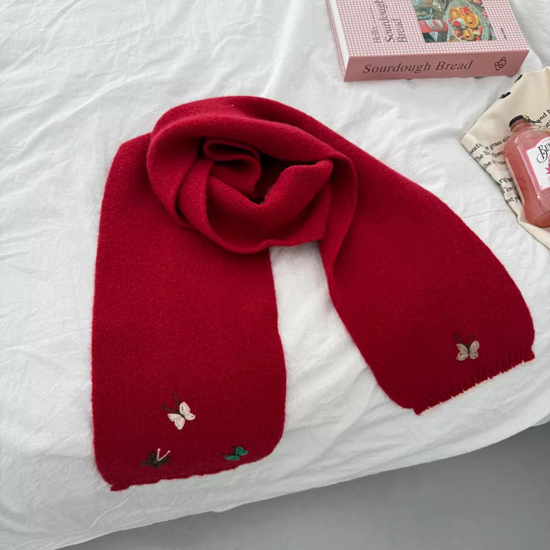 Unisex Butterfly Embroidered Scarf — red embroidered scarf tied on a pale surface
