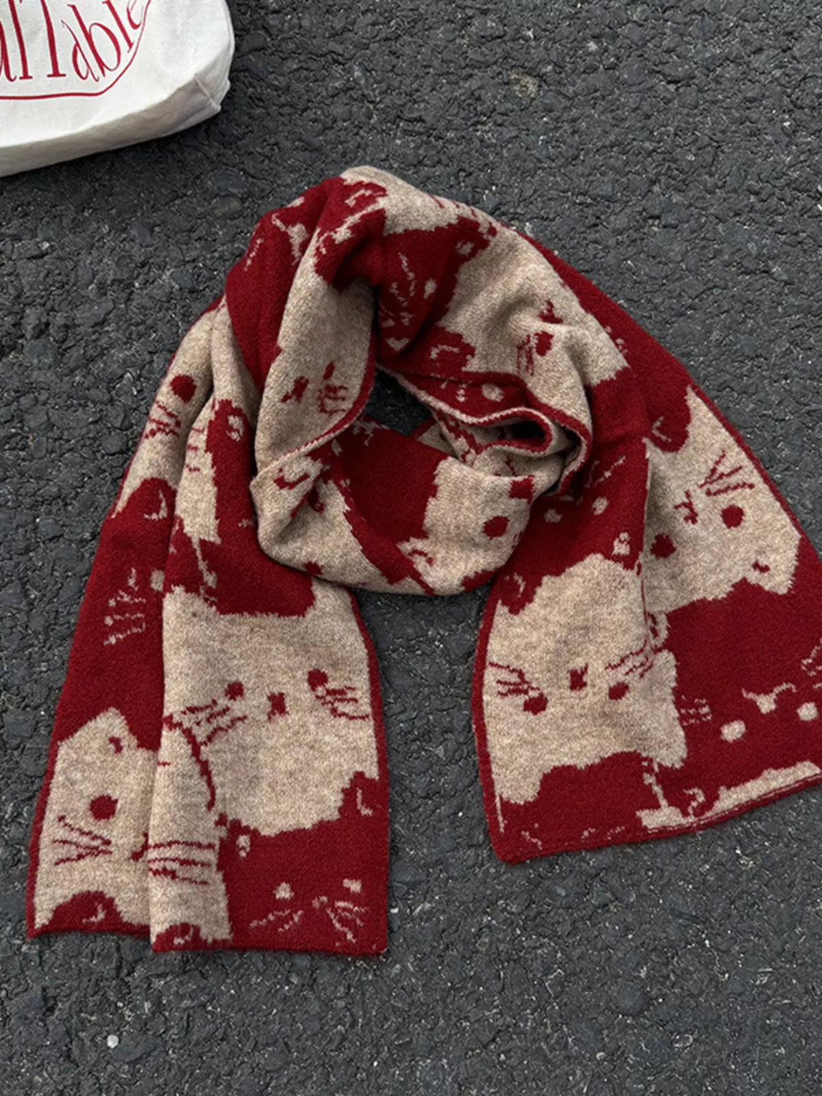 Unisex Allover Cat Knit Scarf — red and cream cat scarf tied with both ends visible