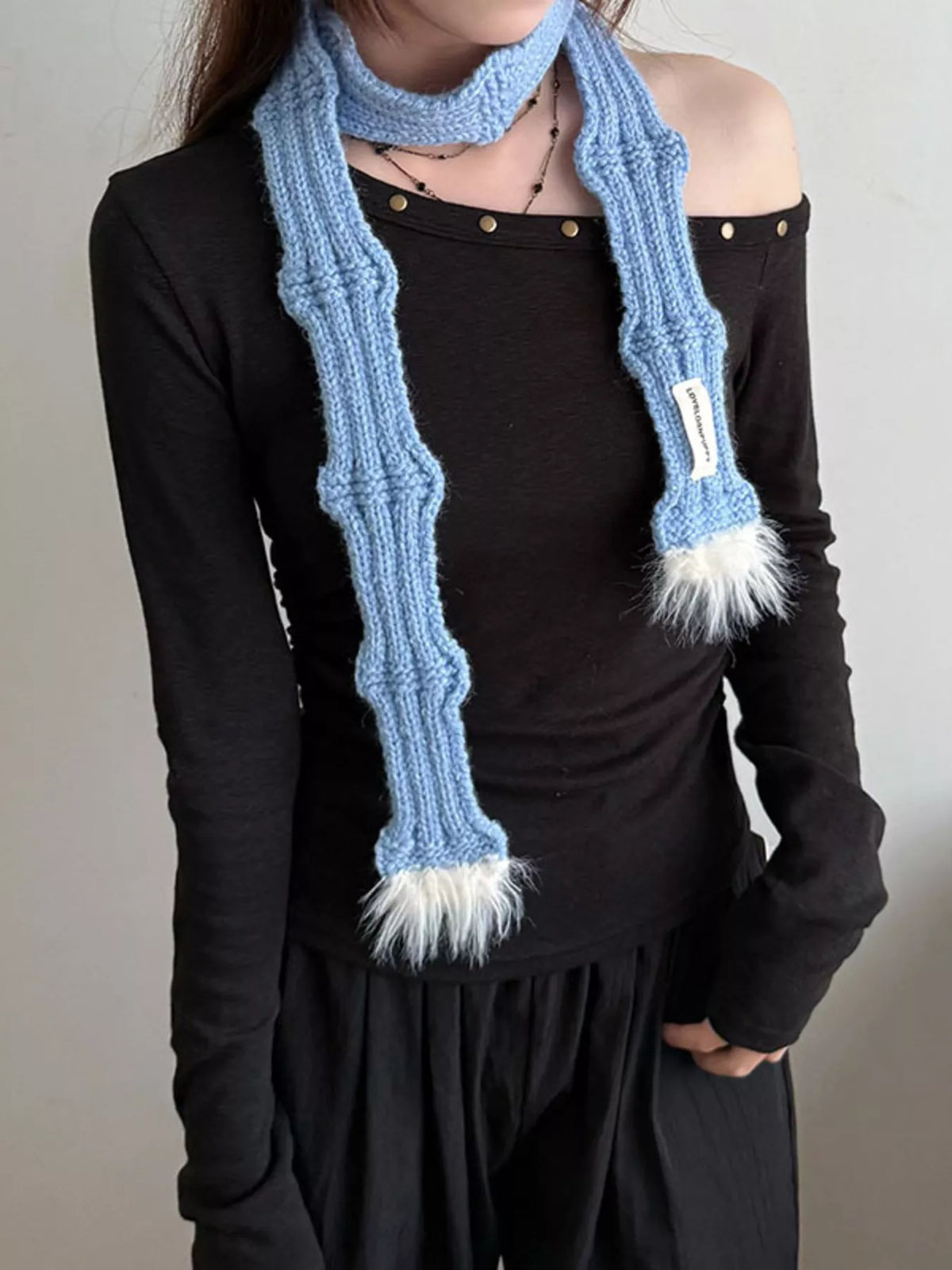 Unisex Plush-Tip Skinny Knit Scarf — blue slim scarf worn over a black top