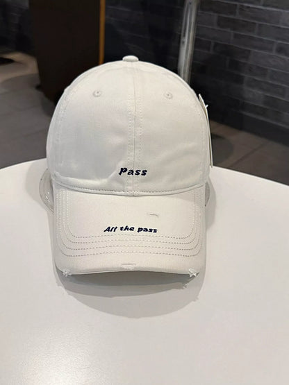 Distressed slogan cap embroidery close-up