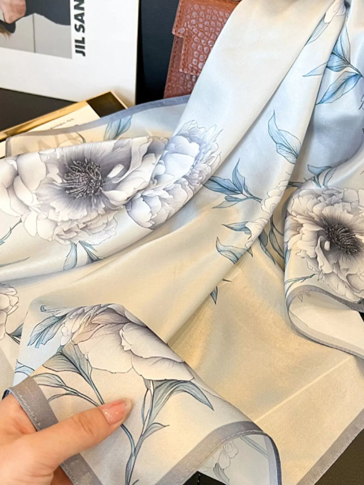 Unisex Floral Print Silk Square Scarf — gathered silk scarf showing blue edged floral panels