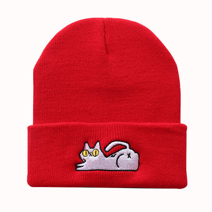 Red acrylic knit beanie with lazy cat detail