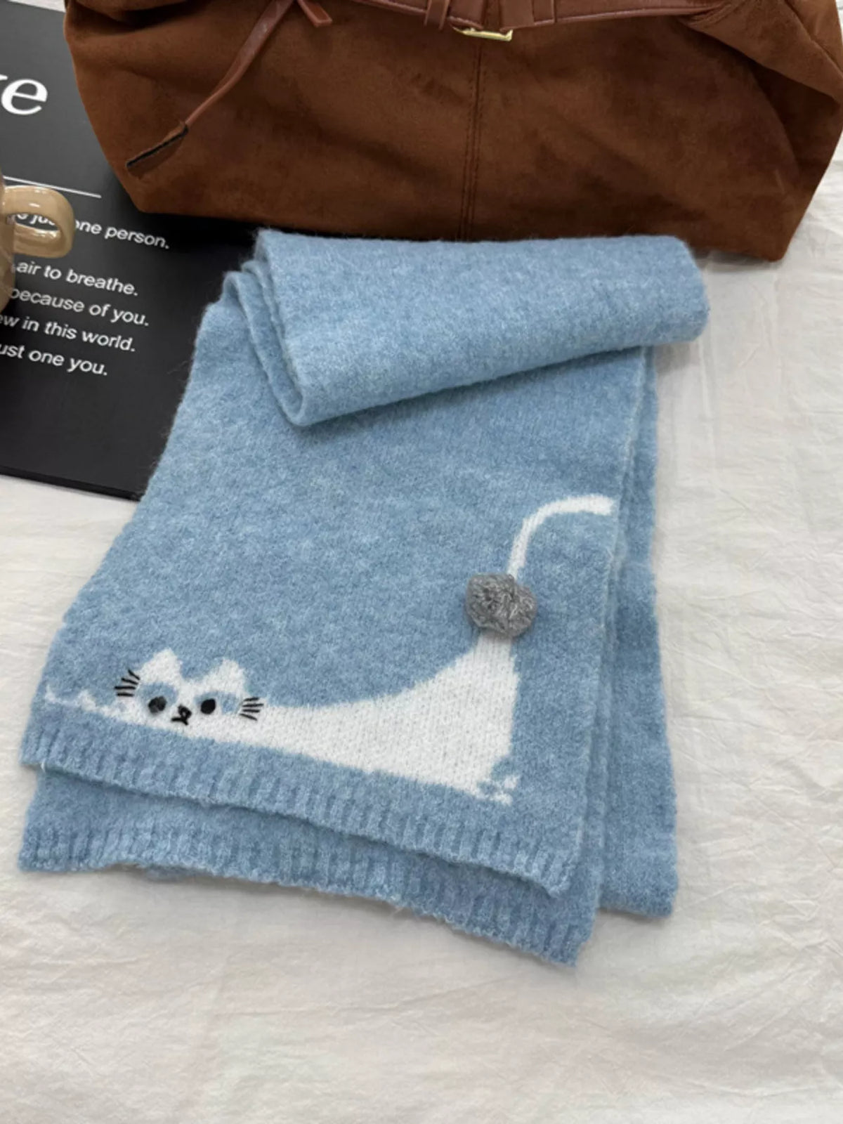 Unisex Playful Cat Knit Scarf — blue scarf folded to show the long-tail cat motif