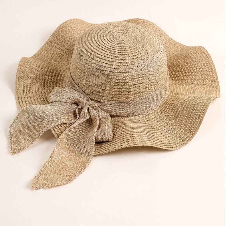 Women's Beige Linen Ribbon Handwoven Wide Brim Bow Straw Sun Hat texture close-up