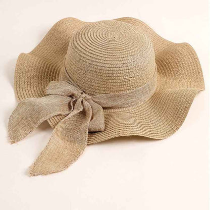 Women's Beige Linen Ribbon Handwoven Wide Brim Bow Straw Sun Hat texture close-up