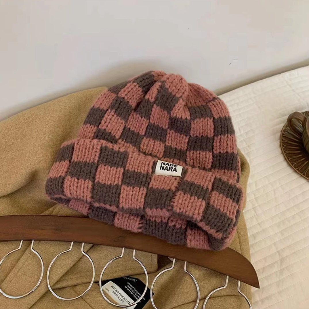 Brown and muted pink checked beanie with rounded crown