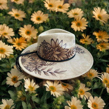 Angled view of the Whiteleaf hat showing the floral crown and decorated brim