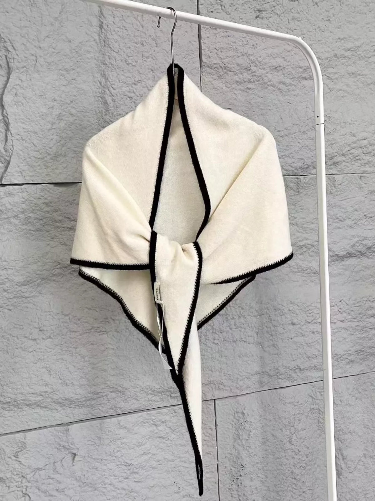 Unisex 100% Wool Contrast Trim Scarf — pale triangular scarf hanging with dark outline visible