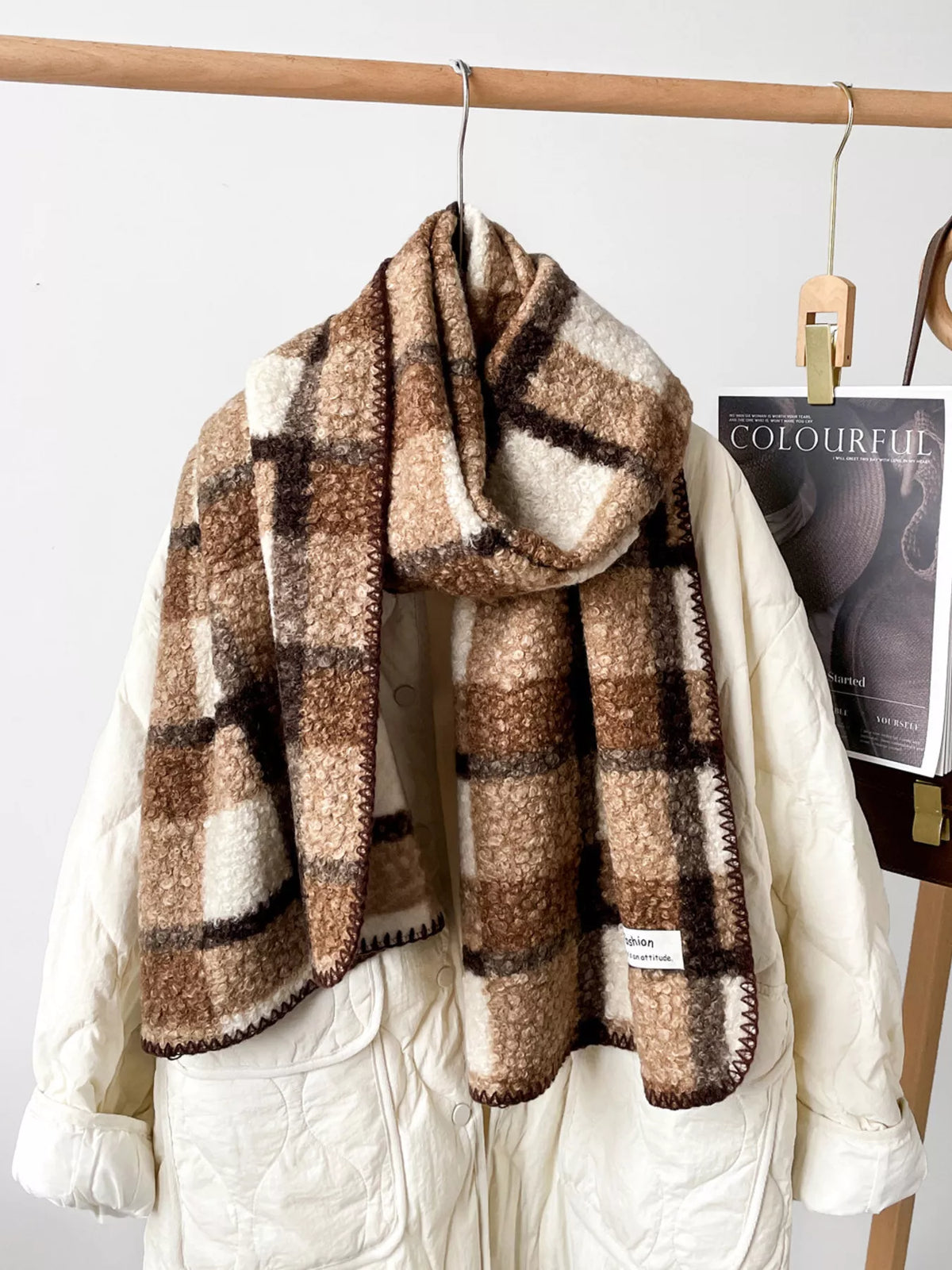 Unisex Textured Plaid Knit Scarf — terracotta and cream plaid scarf over light knitwear