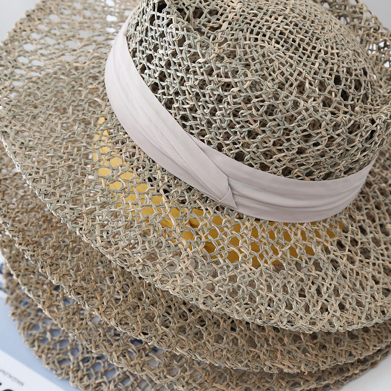 Women's satin-band sun hat brim close-up