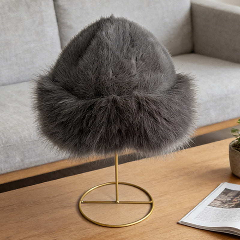 Dark gray plush winter cloche displayed on a hat stand