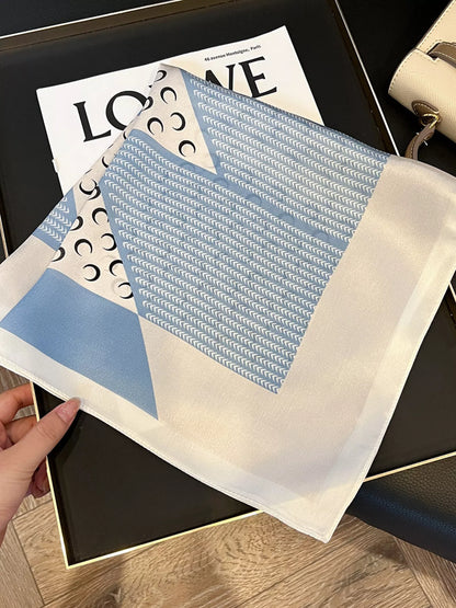 Unisex Printed Silk Square Scarf — partially folded silk square with cream edged border
