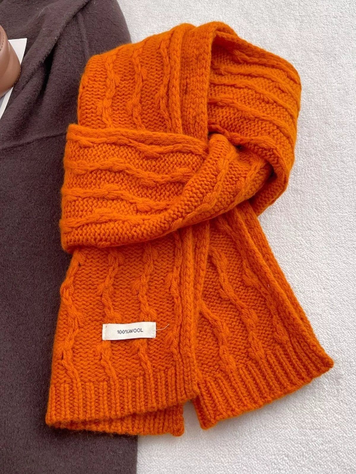 Unisex Wool Cozy Cable Knit Scarf — orange scarf arranged in a loose knot