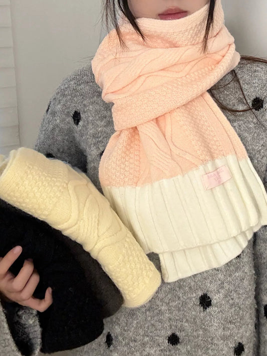 Unisex Two-Tone Cable Knit Scarf — pink cable scarf worn with pale contrasting ends visible