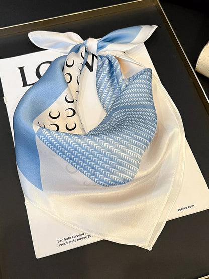 Unisex Printed Silk Square Scarf — pale blue printed silk scarf tied with cream border showing